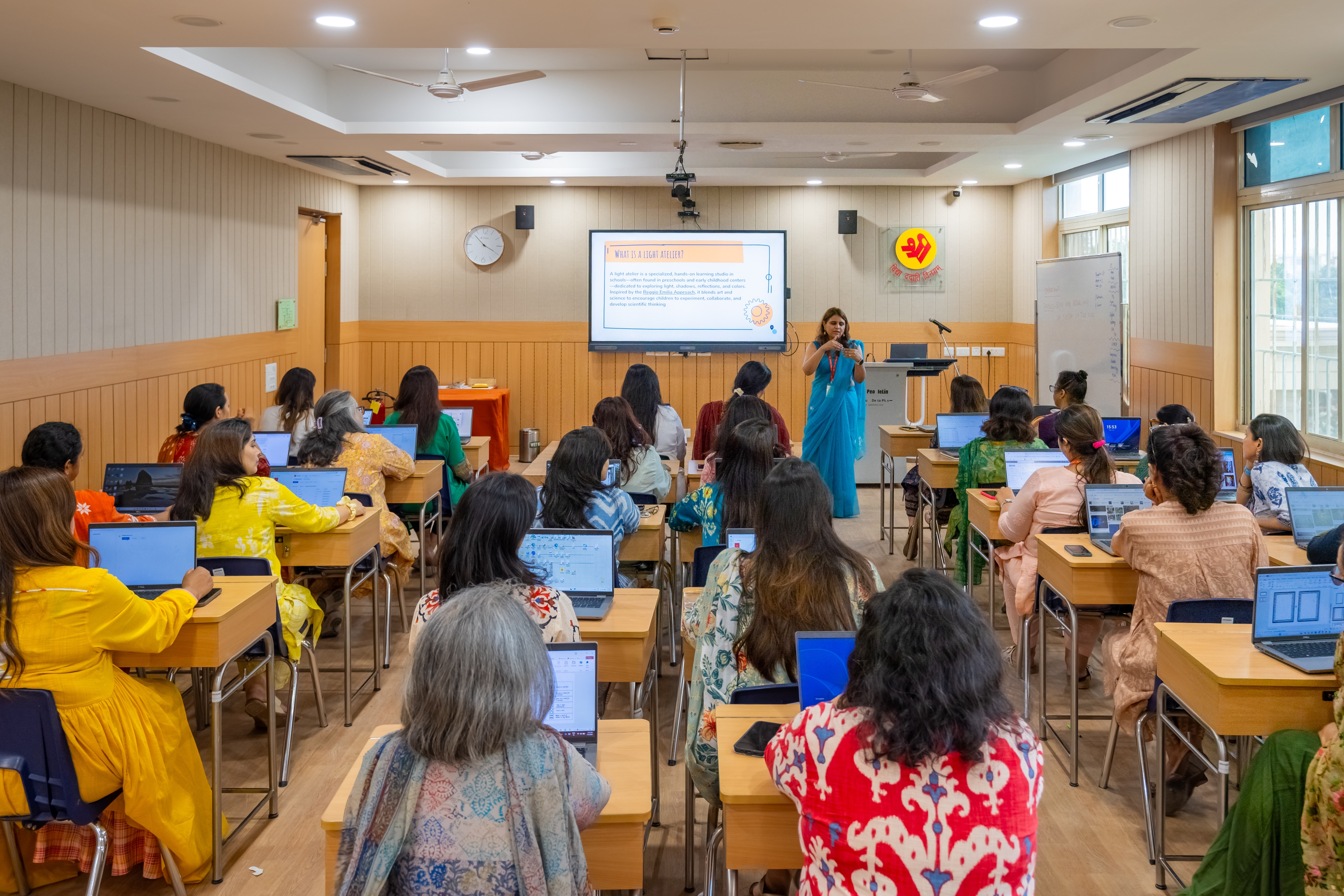 Educators on stage at a Shri Ram School event